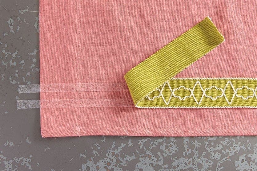 Carefully turn the trim with the tape on the back onto the panel so the iron on tape is facing down.