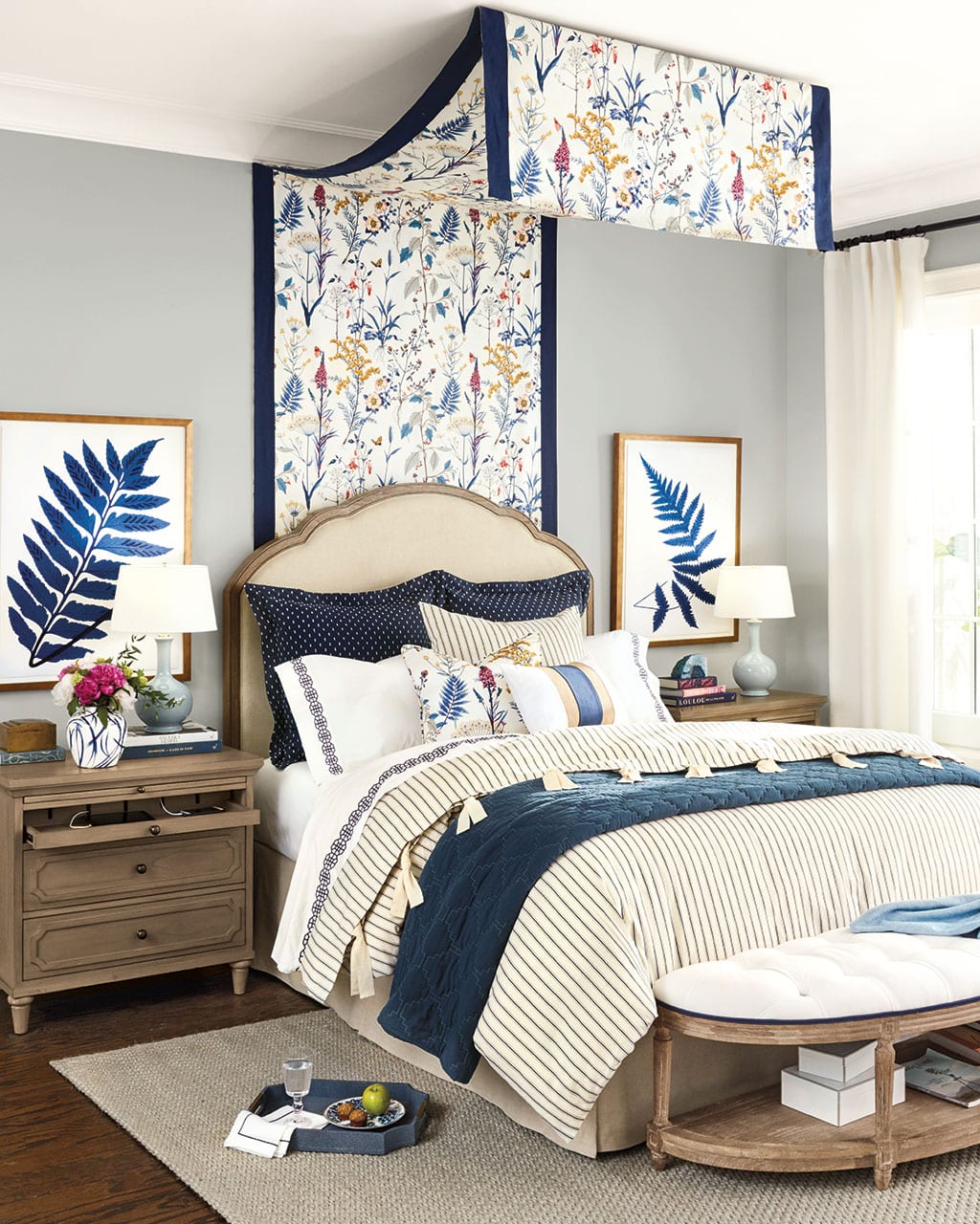 Canopy hanging over a queen bed in master bedroom
