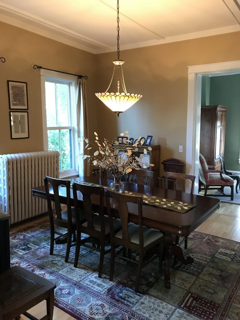 Dining room with sage green wall color