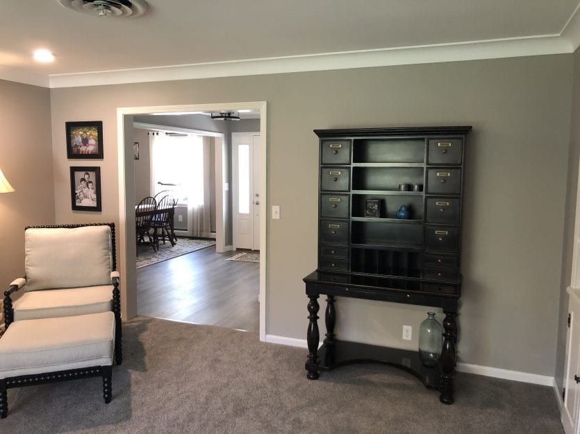 Gray walls in living room with large hutch