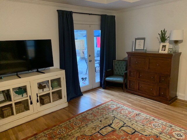 Media cabinet and navy blue drapery in a master bedroom