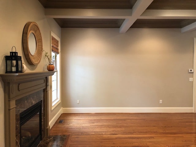 Fireplace in living room with mirror over it