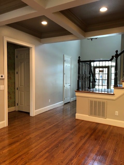 Living room with staircase along back wall