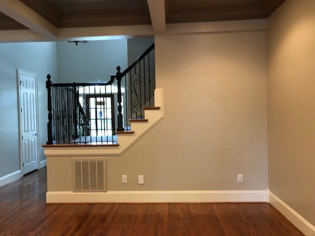 Living room with staircase on back wall