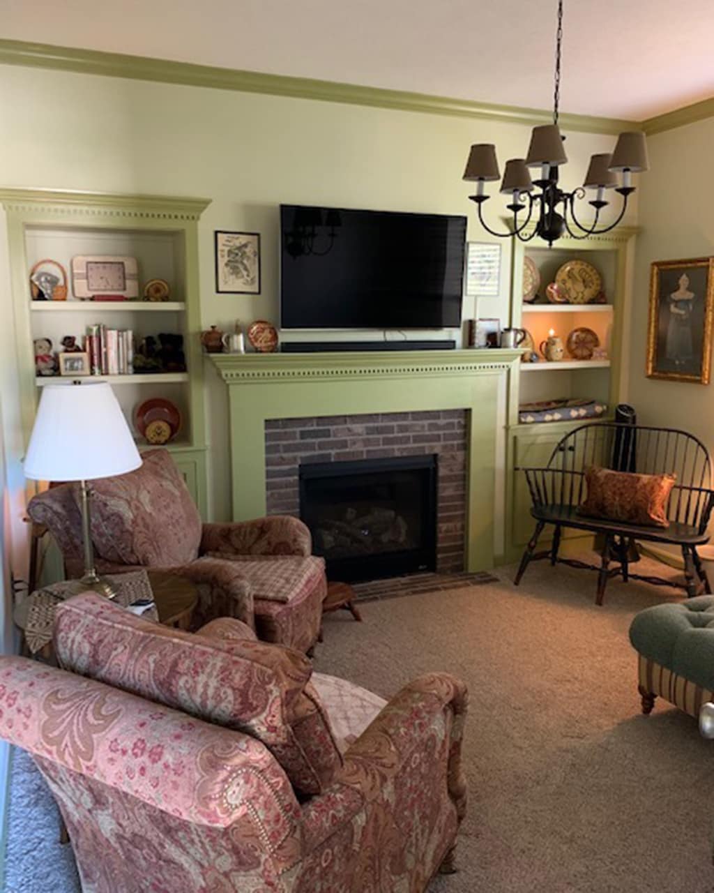 Brenda's living room and den with tone on tone green wallcolor