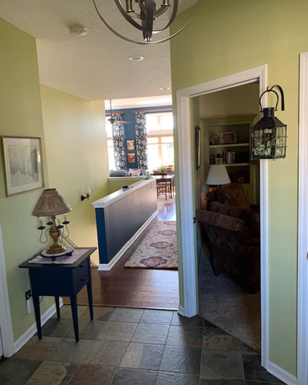 Citron green entryway with tons of doors