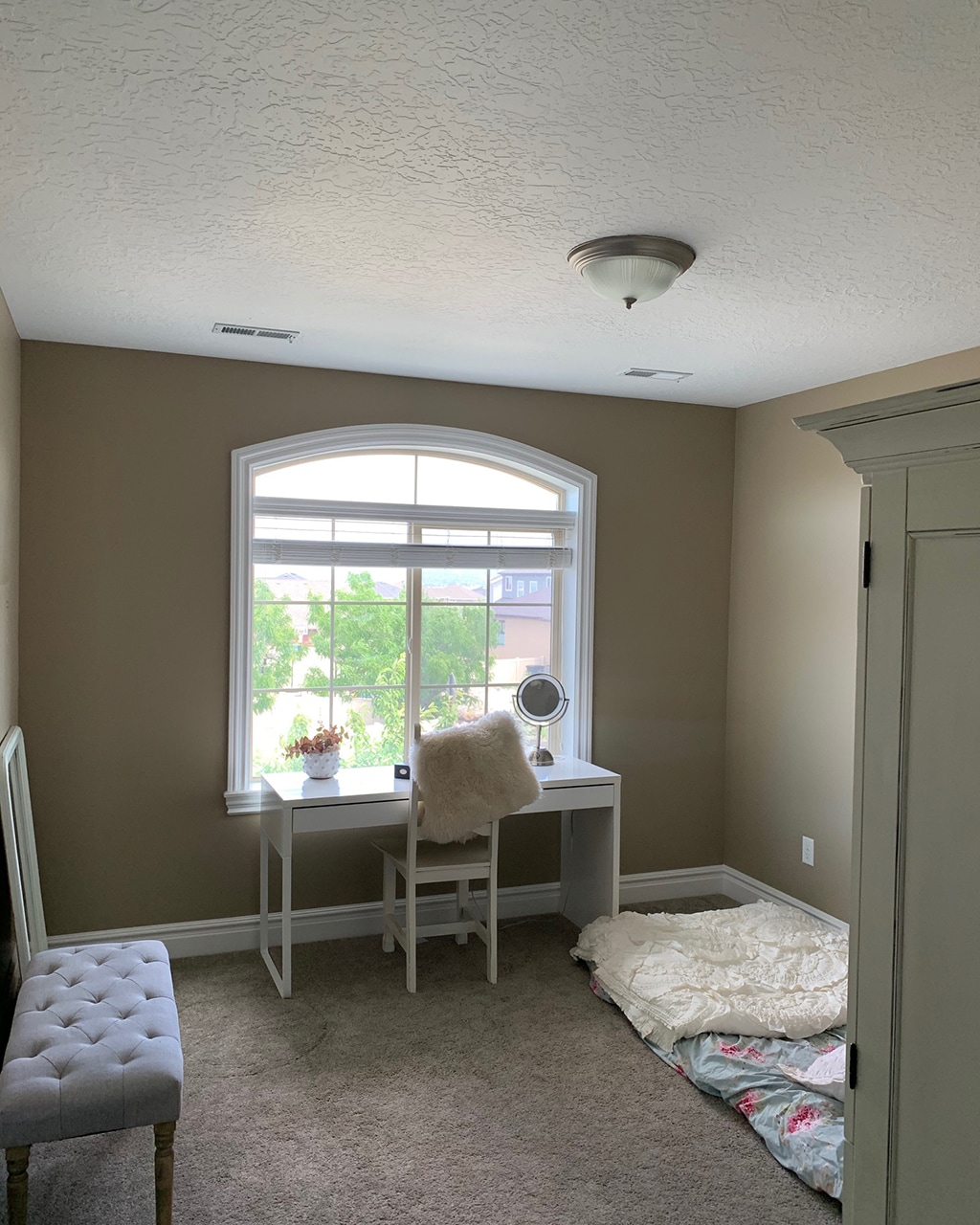 Chloe's extra room with large window and desk