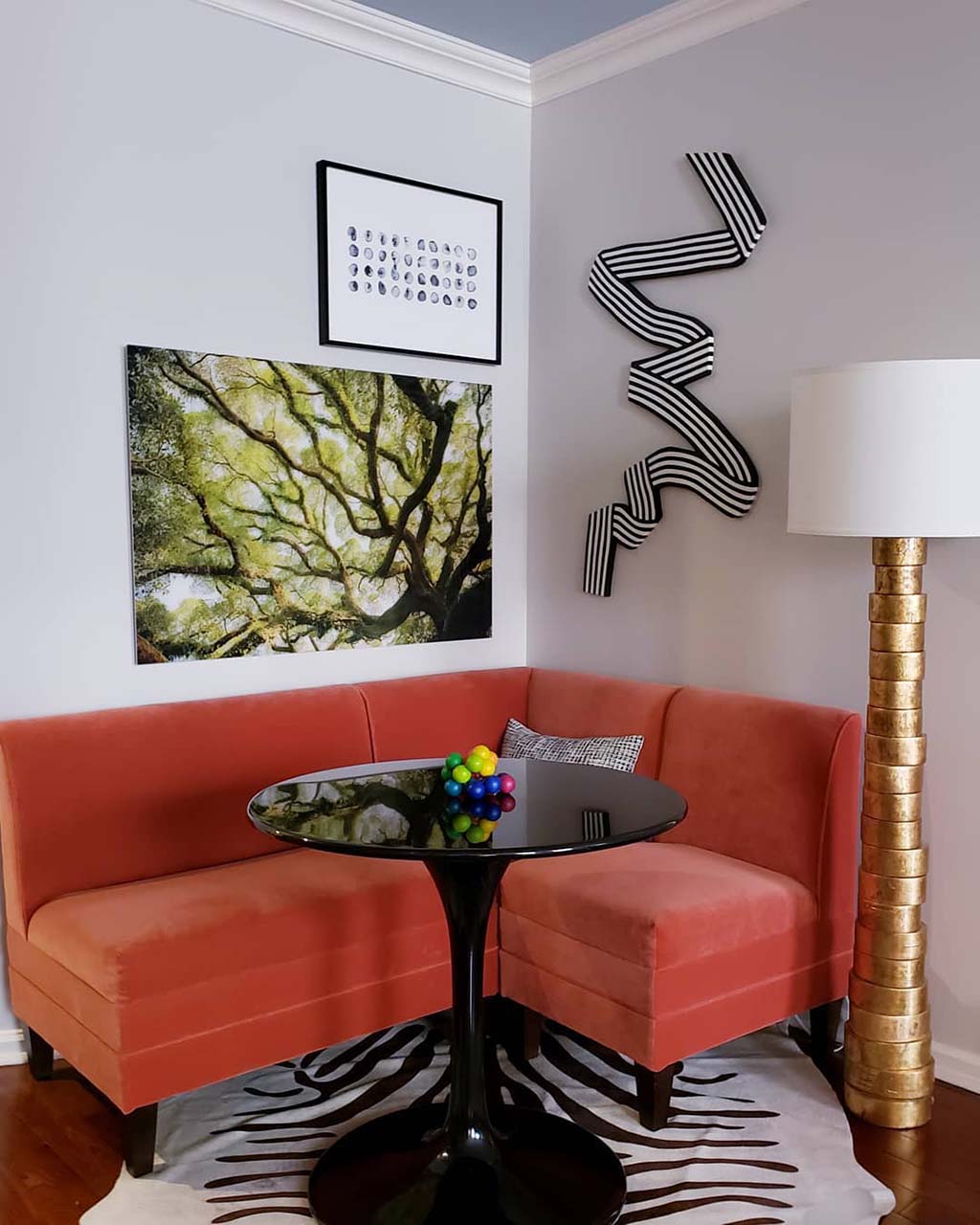 A velvet banquette in a tight corner of a living room
